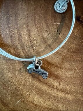 Silver Monopoly Bangle Bracelet one with the car the other with the dog.